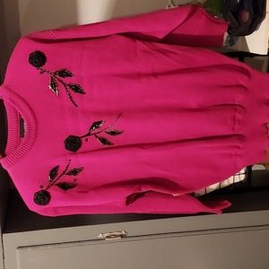 Fushia sweater with blk silk flowers and sequin stems. Size M